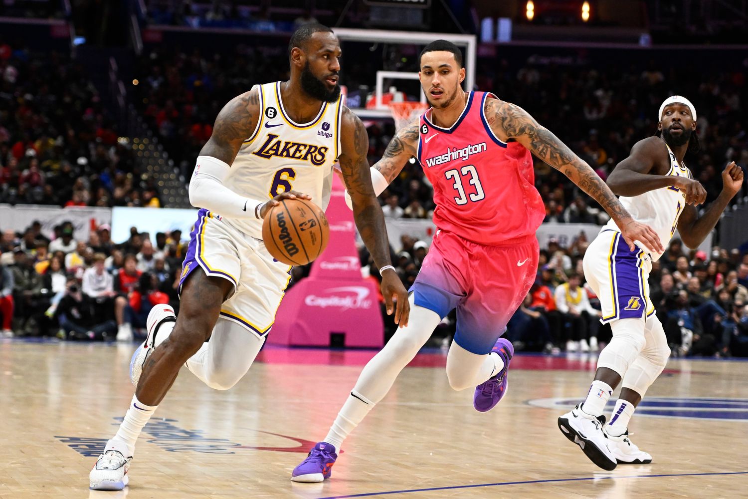 Los Angeles Lakers forward LeBron James (6) drives past Washington Wizards forward Kyle Kuzma (33) during the second half at Capital One Arena. Mandatory Credit: Brad Mills-USA TODAY Sports